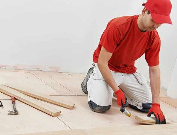 Skilled contractors installing laminate flooring with precision in Charlotte NC